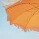 Parasol vintage orange avec franges ø170 x 210.