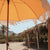 Parasol vintage orange avec franges ø170 x 210.
